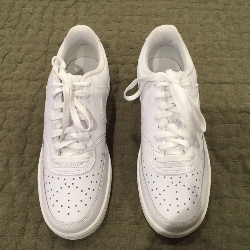 Nike women’s Court Vision low, all white sneakers.